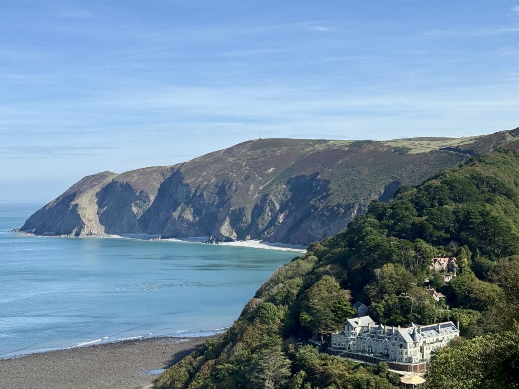 View from Lynton across the wooded North Devon coast and Bristol Channel towards the cliffs of Exmoor.