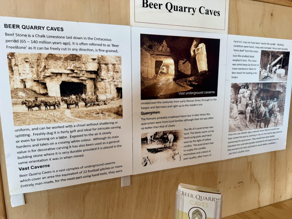 Beer Quarry Caves heritage display with historic photographs of quarrymen, horse drawn stone wagons and the underground caverns.
