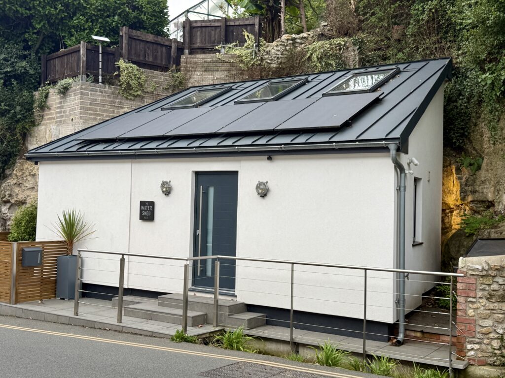 The Water Shed, a compact contemporary holiday cottage for two in the centre of Beer, Devon.