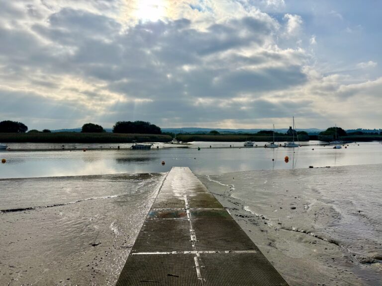 Winter view of the River Exe at Topsham, with estuary mudflats and slipway near Exeter, a popular walking area along the Exe Estuary Trail in Devon.
