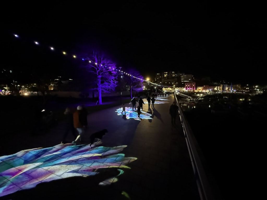 Colourful interactive light projections on Torquay seafront during the Bay of Lights Illumination Trail.