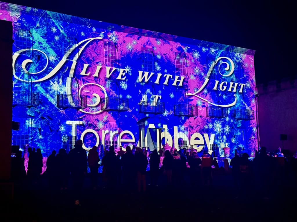 Alive with Light projection show illuminating Torre Abbey during Bay of Lights Torquay.