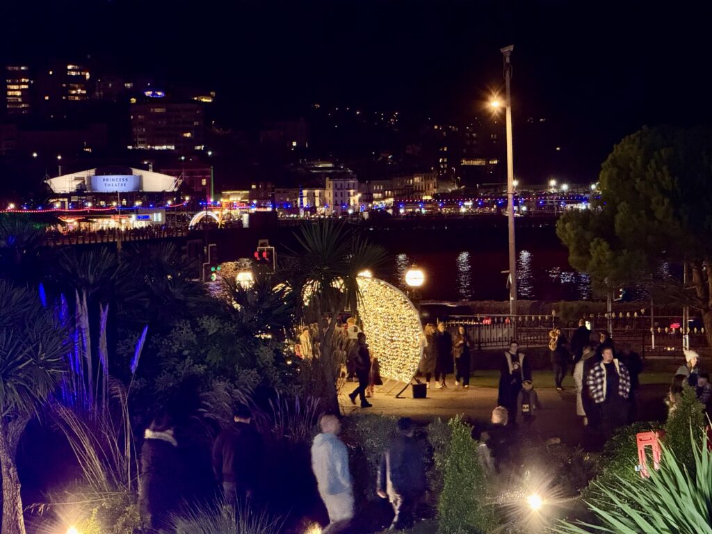 Illuminated Christmas light installation in Torre Abbey Gardens overlooking Torquay seafront during Bay of Lights.