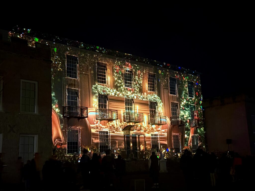 Alive with Light projection illuminating the historic façade of Torre Abbey during Bay of Lights Torquay.
