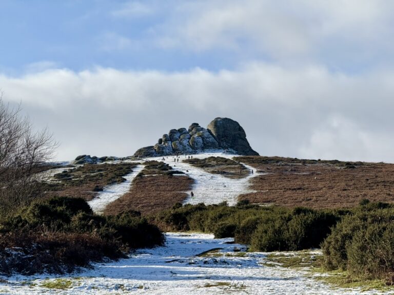 Snow-dusted path leading to Haytor Rocks on Dartmoor, often included in guided Dartmoor tours from Devon.