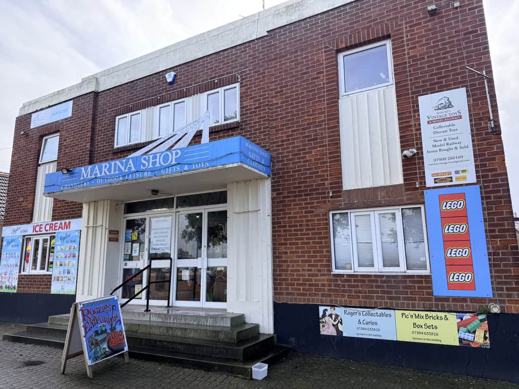 Marina Shop Watchet near the harbour selling beach goods, gifts, ice cream and collectibles with Rogers Collectables and LEGO upstairs.
