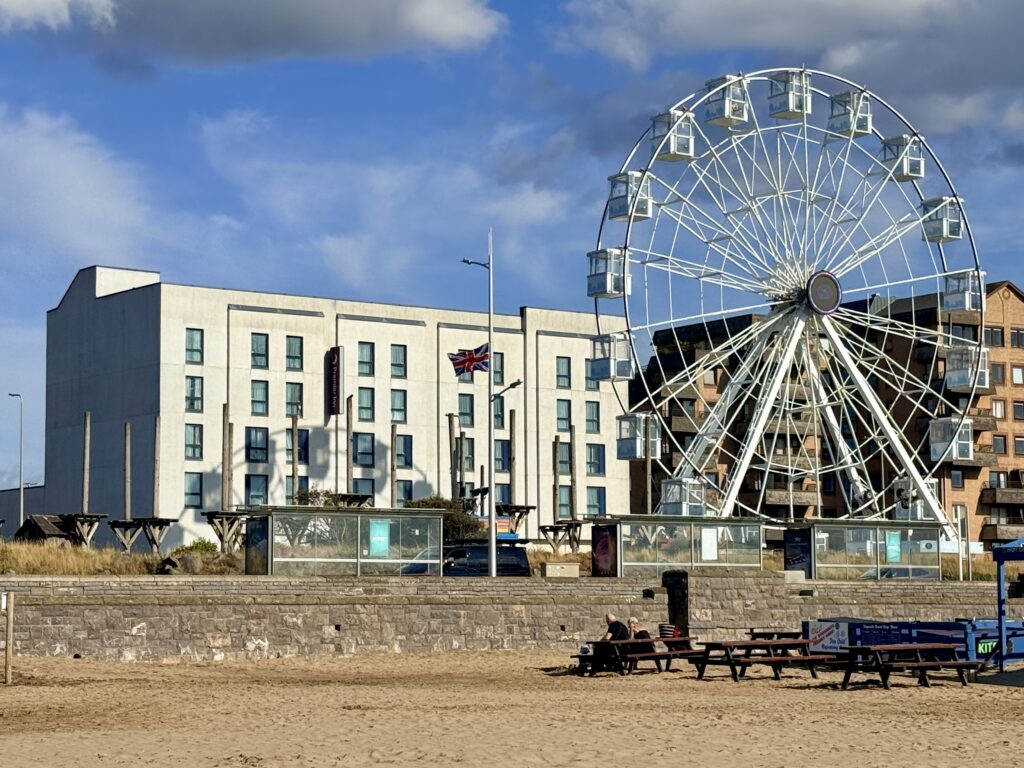 Premier Inn Weston-super-Mare Seafront hotel beside the beach, with the seafront big wheel in the foreground.
