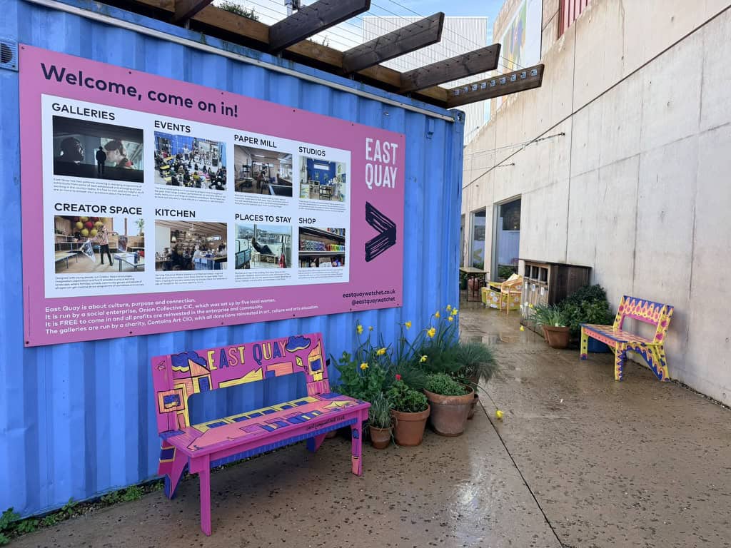 East Quay Watchet visitor area with colourful benches, signage and creative spaces by the harbour in Somerset