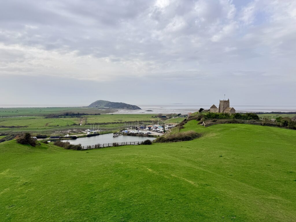 Uphill Marina and St Nicholas Church viewed from the Brean Down Way, with Brean Down visible in the distance across the Somerset coast.