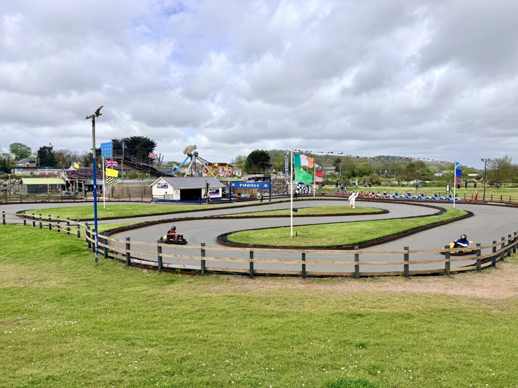 Dawlish Warren amusement area, Devon with go-kart track, fairground rides and family attractions.