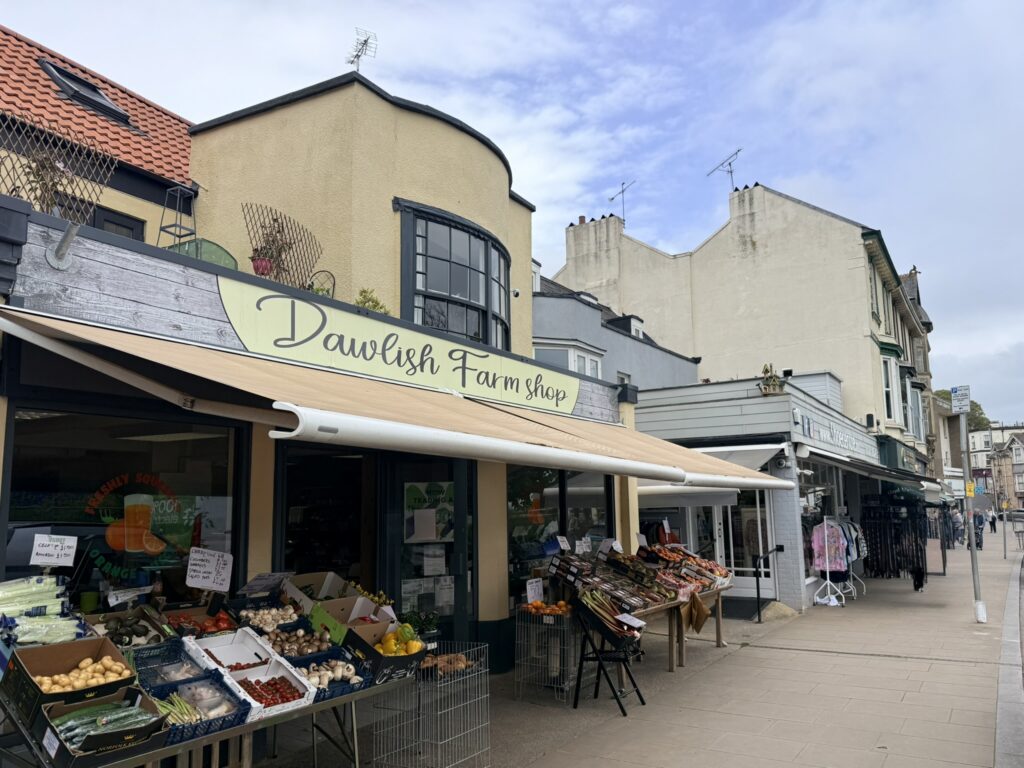 Dawlish town centre, Devon with independent shops, cafés and a farm shop on a quiet high street.