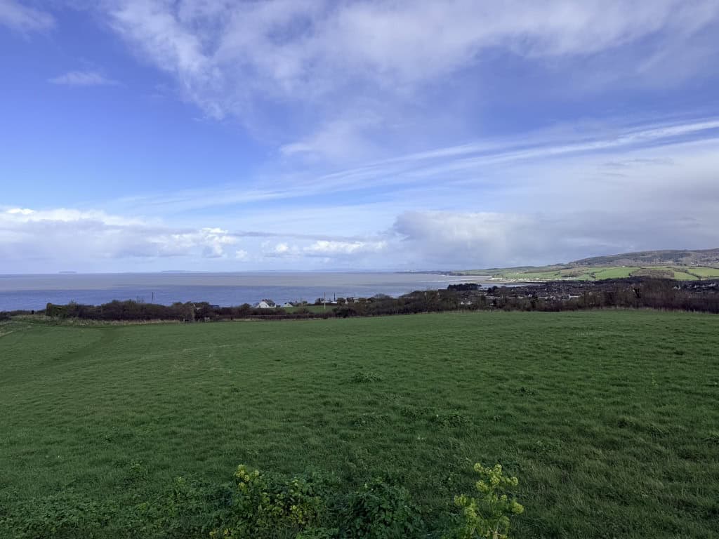 View from Daw’s Castle looking back towards Watchet, with the Bristol Channel, coastline and surrounding countryside stretching into the distance. This section forms part of the King Charles III England Coast Path, Watchet to Minehead walk.