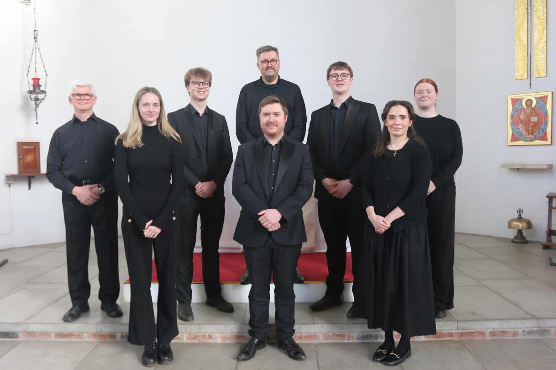 Vocal ensemble group preparing before performance at St Michael & All Angels Exeter for Music on the Mount concert series, what’s on in Devon