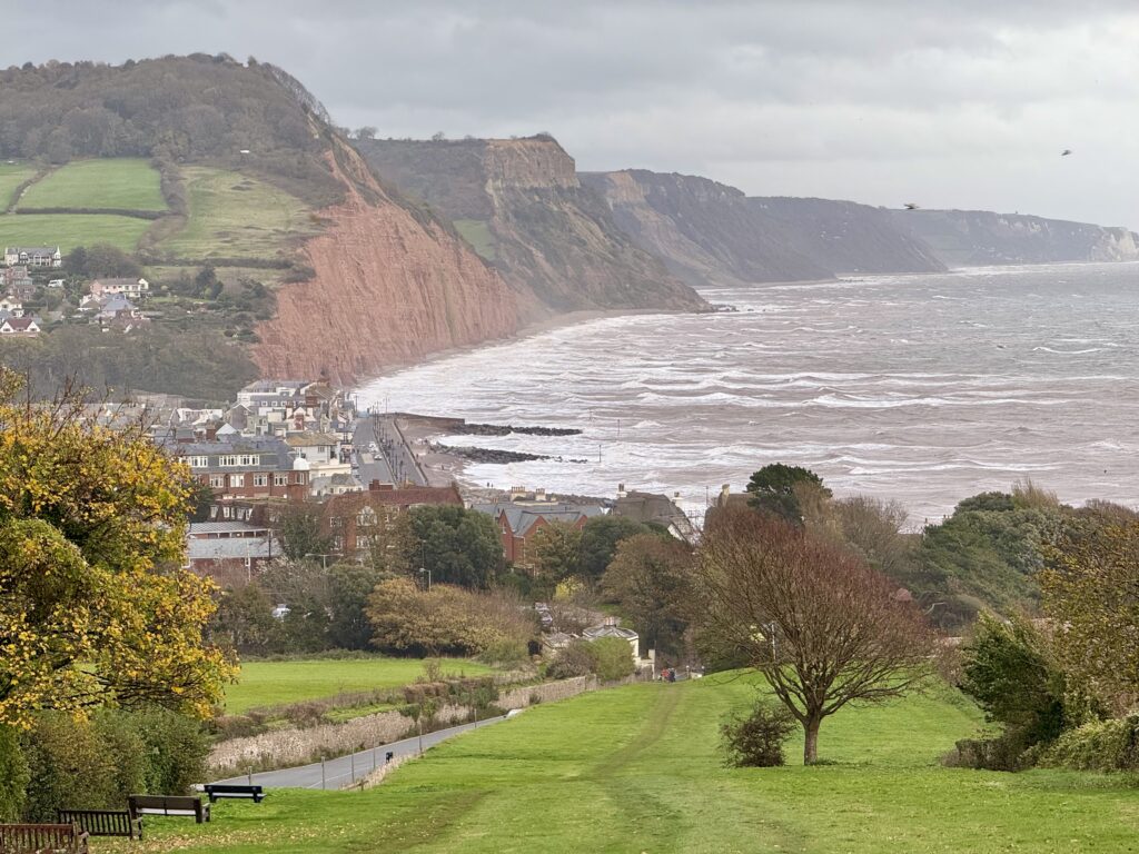 View of Sidmouth from Peak Hill, showing the town, Jurassic Coast, red sandstone cliffs and Lyme Bay in East Devon.