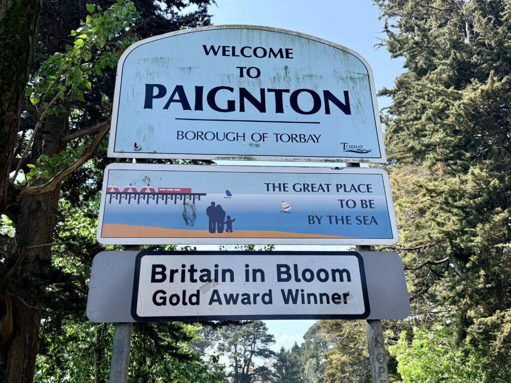 Welcome to Paignton sign on the approach to the town on the English Riviera, one of the best Torbay beaches destinations in South Devon.