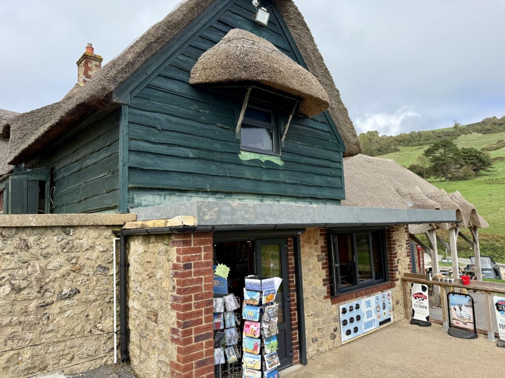 Sea Shanty shop and café in a thatched stone building beside Branscombe Beach, Devon.