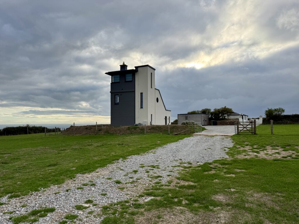 The restored Lookout Tower standing in open fields on Beer Head above the coast between Beer and Branscombe, Devon.