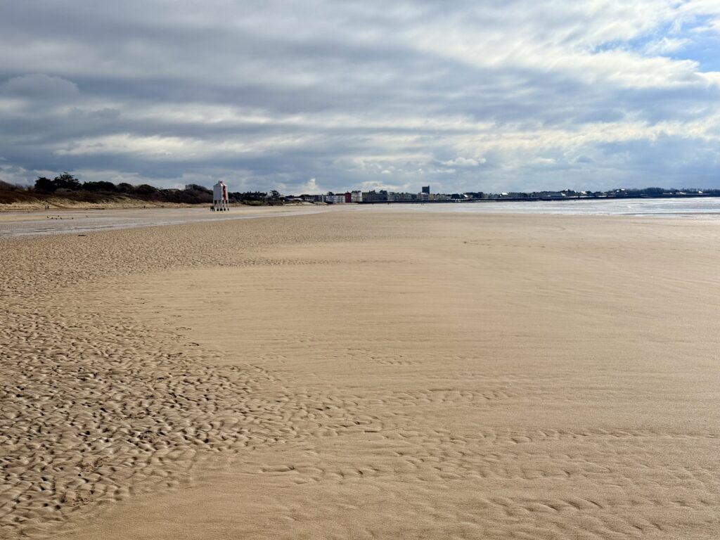 Berrow Beach looking towards Burnham-on-Sea, with the distinctive Low Lighthouse visible in the distance.