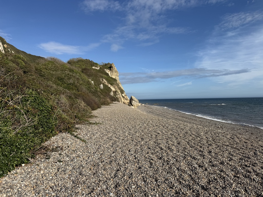 Secluded shingle beach beneath the chalk cliffs at Hooken Beach in East Devon.