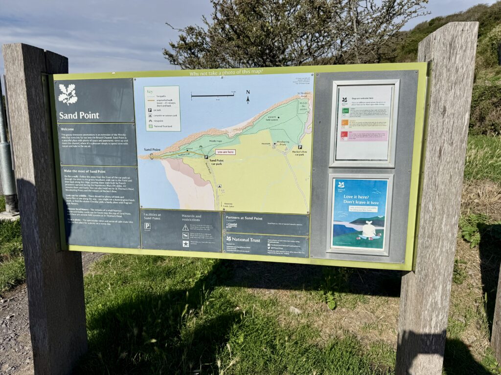 National Trust Sand Point information board and walking map beside the car park
