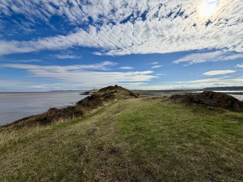 Looking back along the rocky headland from Sand Point towards Middle Hope