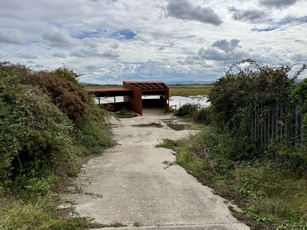 Bird hide at St Thomas's Head overlooking Woodspring Bay and the wetlands at the former MOD weapons testing site